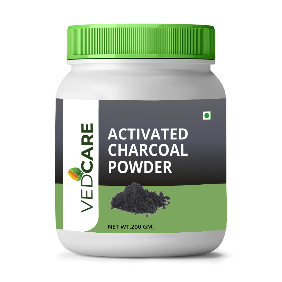 Jar of Vedcare Activated Charcoal Powder with green lid on a white background