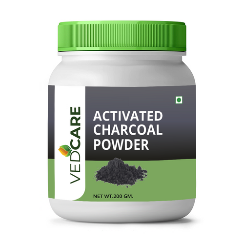 Jar of Vedcare Activated Charcoal Powder with green lid on a white background