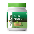 Jar of Vedcare Tulsi Powder with green lid and label on a white background