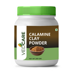 Jar of Vedcare Calamine Clay Powder with green lid on a white background
