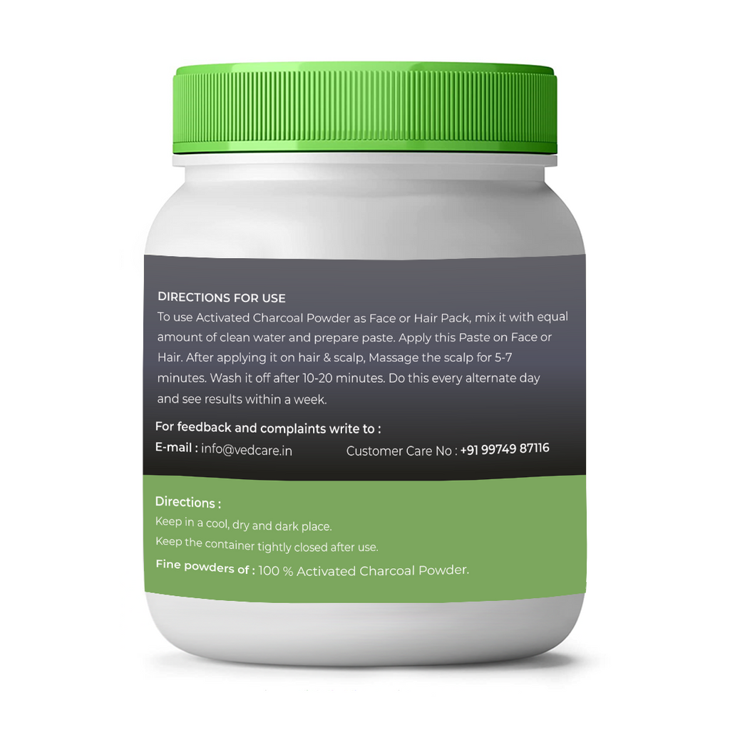 Container of activated charcoal powder with green lid and label on a white background
