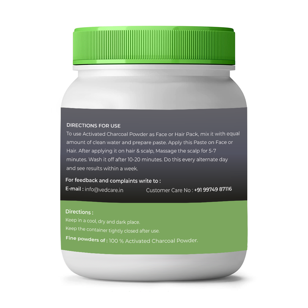 Container of activated charcoal powder with green lid and label on a white background