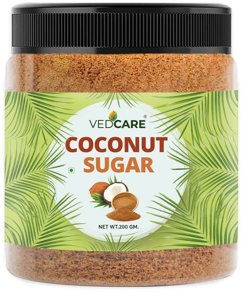 Jar of VedCare coconut sugar with a green label and black lid.