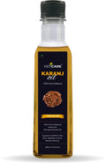 Bottle of VedCare Karanj oil on a white background
