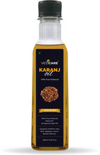 Bottle of VedCare Karanj oil on a white background