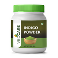 Vedcare Indigo Powder container with green lid on a white background
