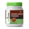 Jar of Ashok Chhal Powder with a green lid on a white background