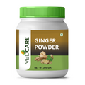 Vedcare Ginger Powder jar with green lid on a white background