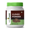 Jar of Vedcare Cloves Powder with a green lid on a white background