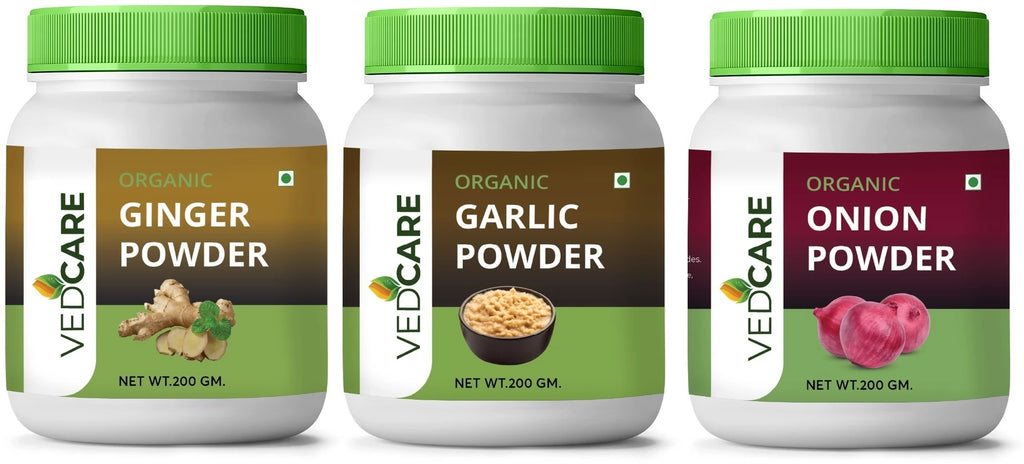 Three bottles of Vedcare organic powders with green lids on a white background