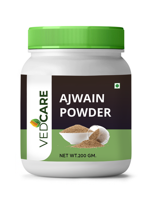 Jar of Ajwain powder with a green lid on a white background