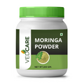 Vedcare Moringa Powder container with green lid on a white background