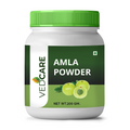 Vedcare Amla Powder container with green lid and label on a white background