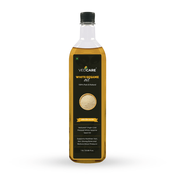 Bottle of VedCare White Sesame Oil on a white background