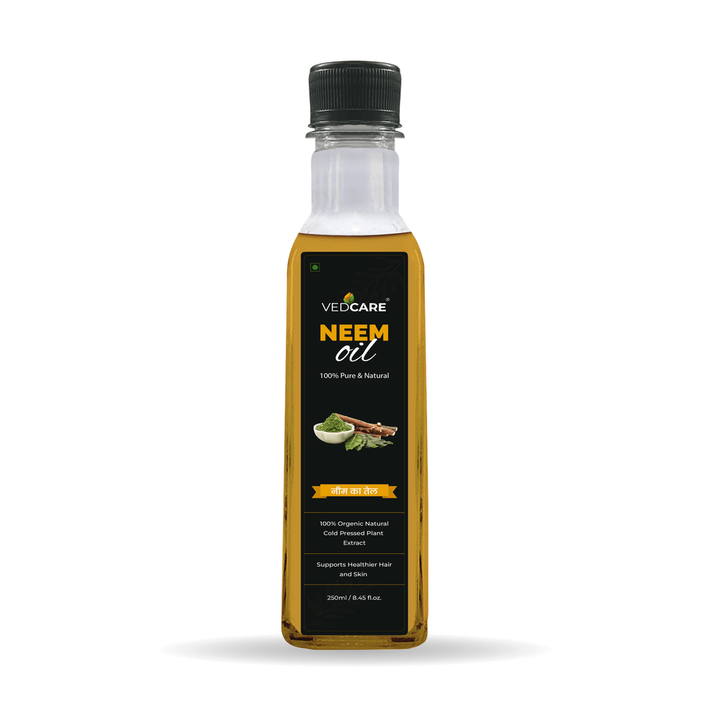 Bottle of VedCare Neem oil on a white background