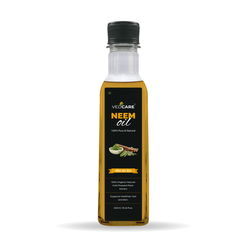 Bottle of VedCare Neem oil on a white background