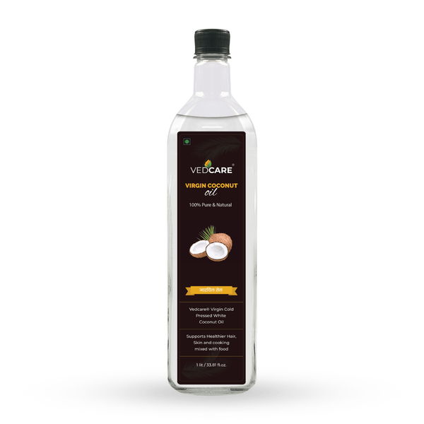 Bottle of VedCare Virgin Coconut Oil on a white background