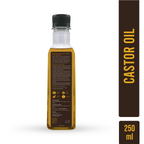 Bottle of castor oil with label and box on a white background