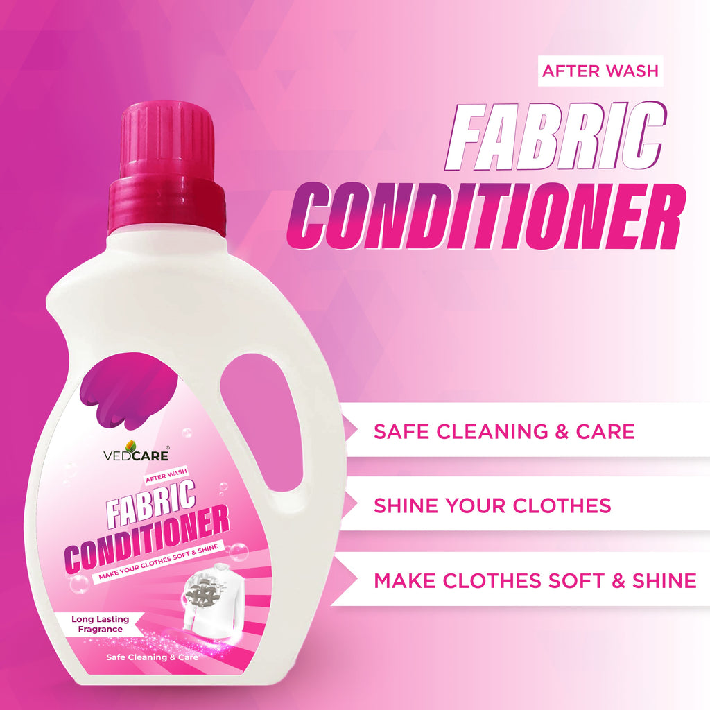 Fabric conditioner bottle with pink cap on a pink background