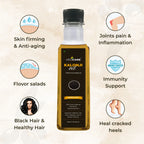 Vedcare Kalonji oil bottle with health benefits listed on a beige background