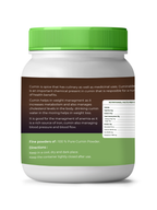 Jar of cumin powder with green lid and label on a white background