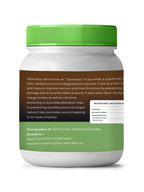 Jar of Jatamansi powder with green lid and label on a white background