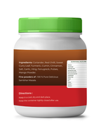 Container of vedcare Sambhar Masala with green lid and multicolored label on a white background