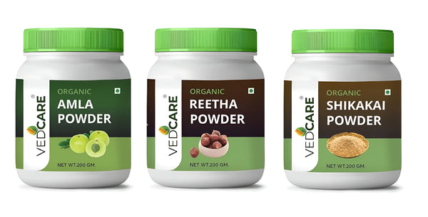 Three jars of Vedcare organic powders on a white background