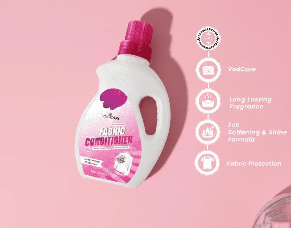 Fabric conditioner bottle with pink label on a pink background