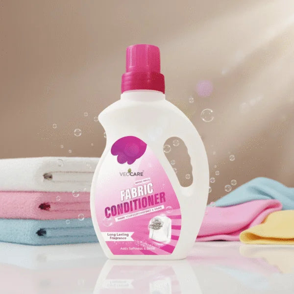 Fabric conditioner bottle with colorful cloths in the background