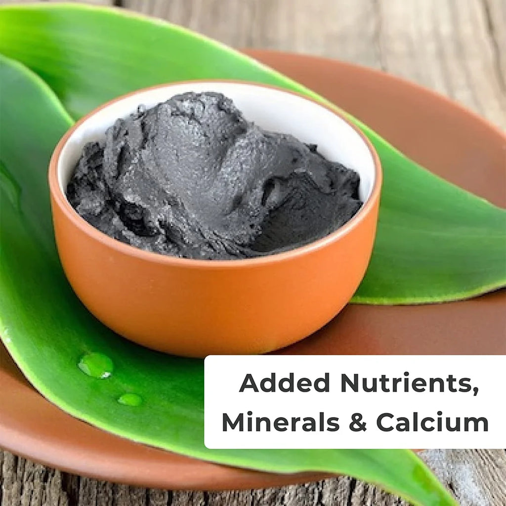 Bowl of dark gray substance on a green leaf with text 'Added Nutrients, Minerals & Calcium'.