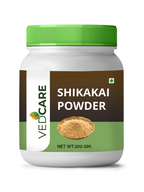 Jar of Shikakai Powder with green lid and label on a white background